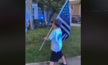 Boy runs with Blue Line Flag to honor fallen Cowlitz County Sheriff’s Deputy