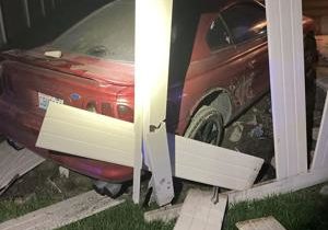 Man arrested after crashing into a fence in Kennewick