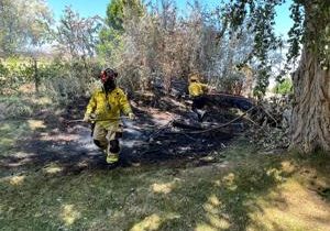 Yard fire caused by cigarette under control in Kennewick