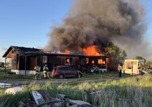 Fire crews responding to burning empty home in Finley