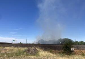 Crews fight fire on train tracks near Canal Drive in Kennewick