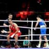 Algeria boxer in Olympic gender row wins in 46 seconds as Italian PM hits out