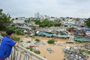 ‘Scared’: desperate Vietnamese flee flood-hit homes