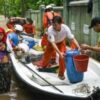 Myanmar residents flee deadly floods in boats and on makeshift rafts