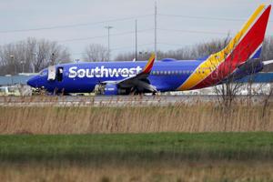 Southwest Airlines says it is ending cabin service earlier to reduce chance of injury