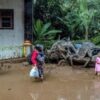 Indonesia digs out as flooding, landslide death toll hits 20