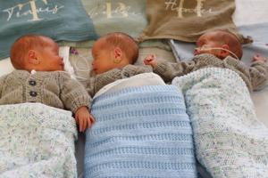 Couple expecting twins on Christmas welcome rare identical triplets early